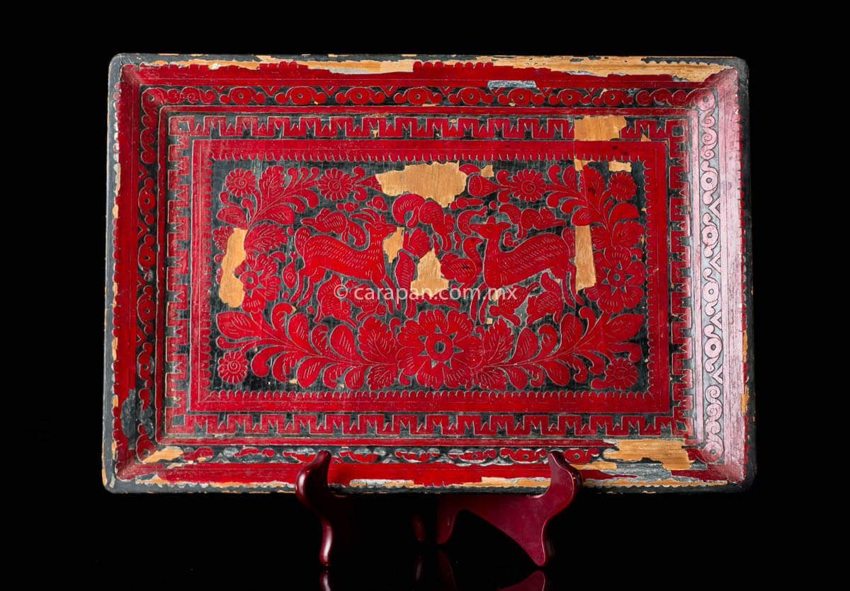Vintage Lacquered Wood Tray with etched deer and vegetal motifs in red over black background. Crafted in the 1960's in Olinalá Guerrero. Due to its vintage condition lacquer is peeled off in some areas.
