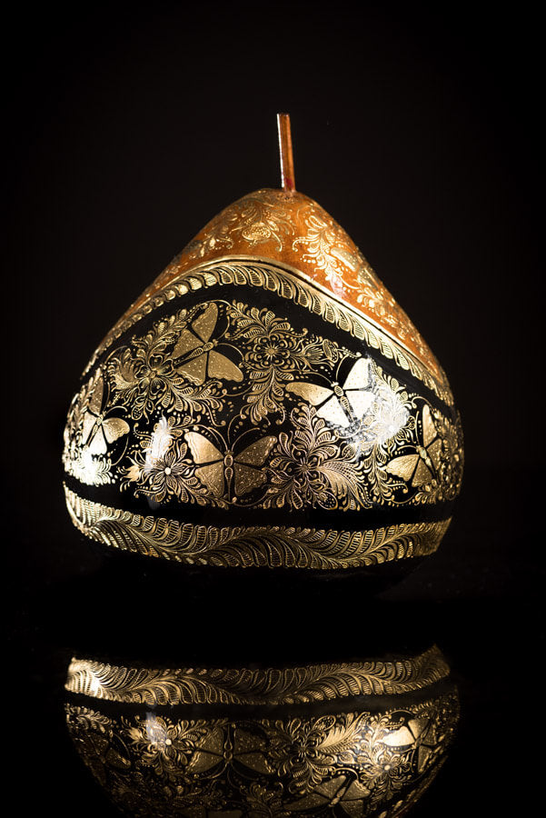 Gold Outlined lacquered gourd decorated with butterflies by Mario Agustin Gaspar