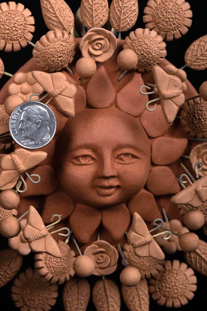 natural-clay-sun-sculpture