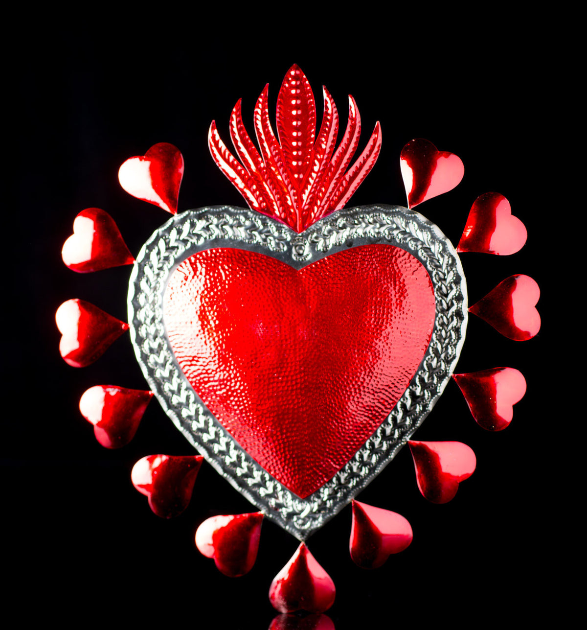 BIG RED TIN SACRED HEART SURROUNDED WITH SMALL HERATS & FLAME ON TOP ART FROM OAXACA MEXICO