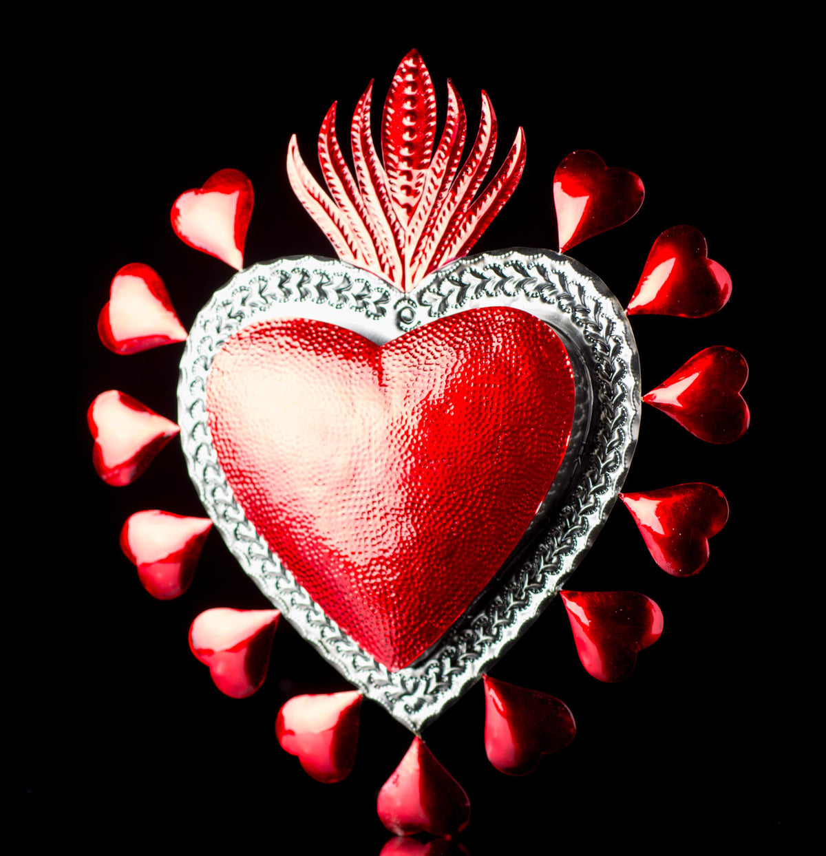 BIG RED TIN SACRED HEART SURROUNDED WITH SMALL HERATS & FLAME ON TOP ART FROM OAXACA MEXICO