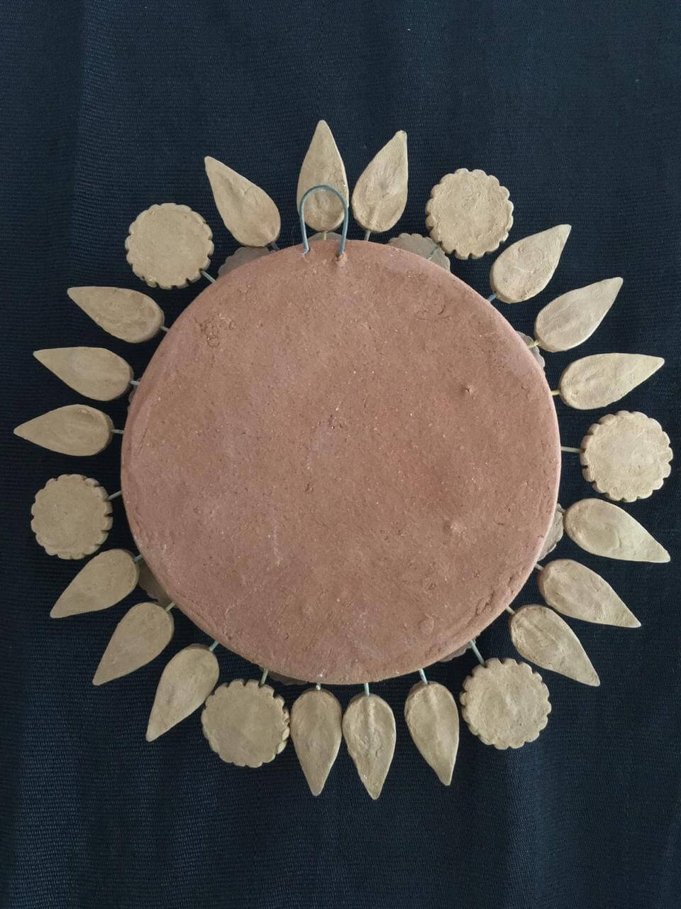 natural-clay-sun-sculpture