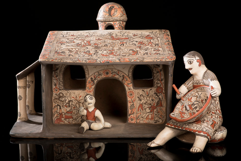 Clay house with woman and baby from Guerrero Mexico