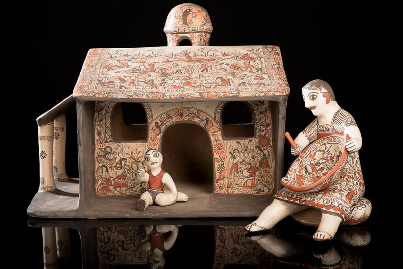 Clay house with woman and baby from Guerrero Mexico