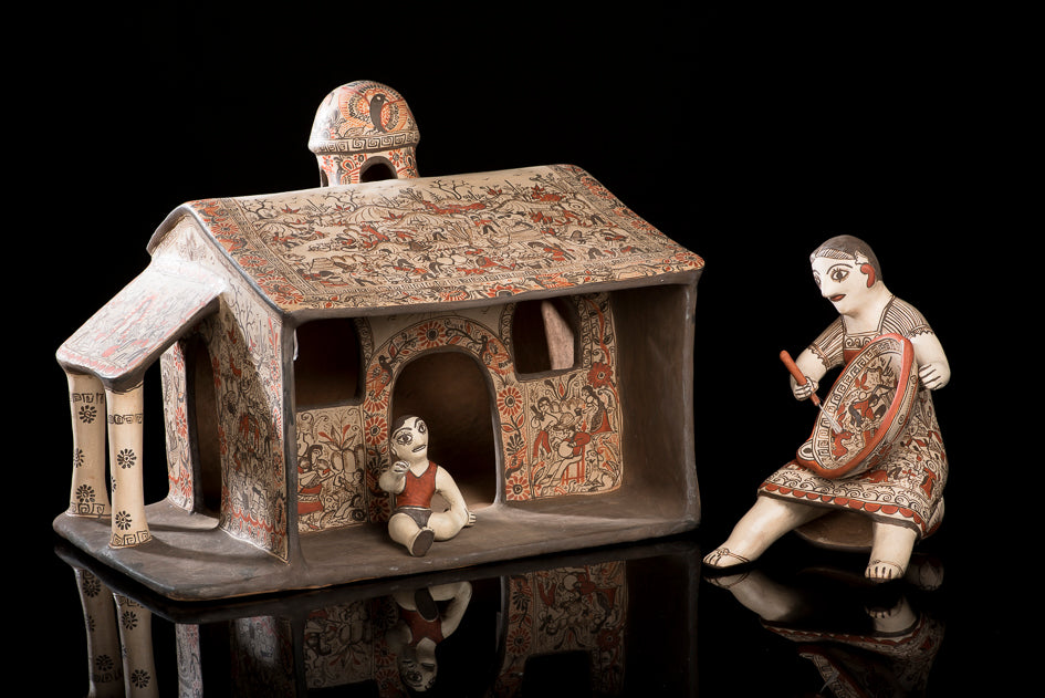 Clay house with woman and baby from Guerrero Mexico